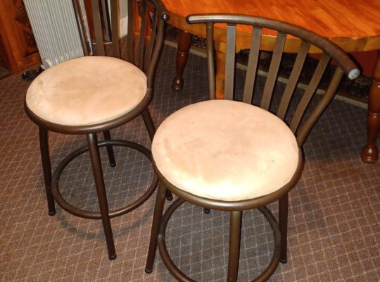 Two short brown bar stools, 24″ seat height, steel