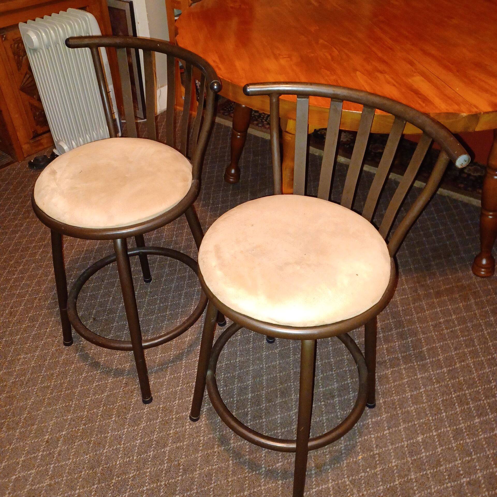Two short brown bar stools, 24″ seat height, steel