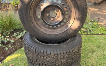 Like new studded tires and wheels 185/70R14