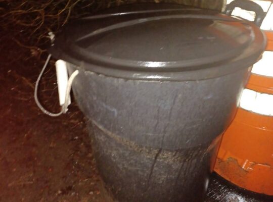 32-gallon garbage can on wheels with lid.