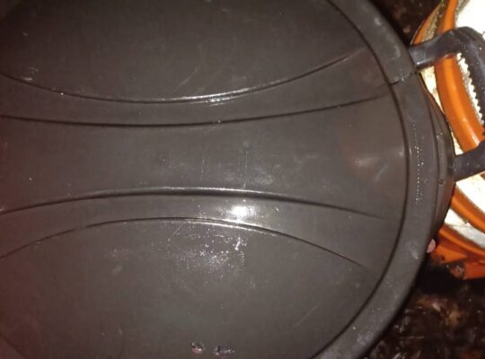 32-gallon garbage can on wheels with lid.