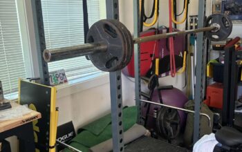 Exercise equipment squat rack bar weights bicycle
