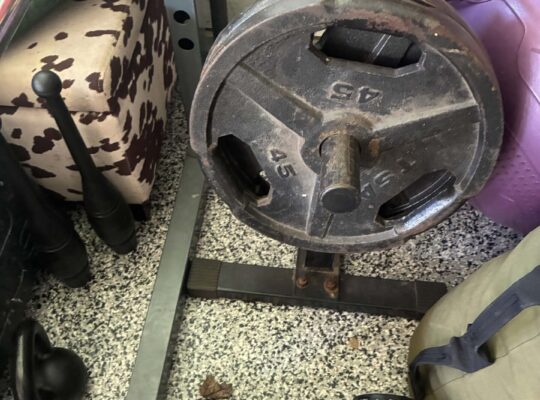Exercise equipment squat rack bar weights bicycle